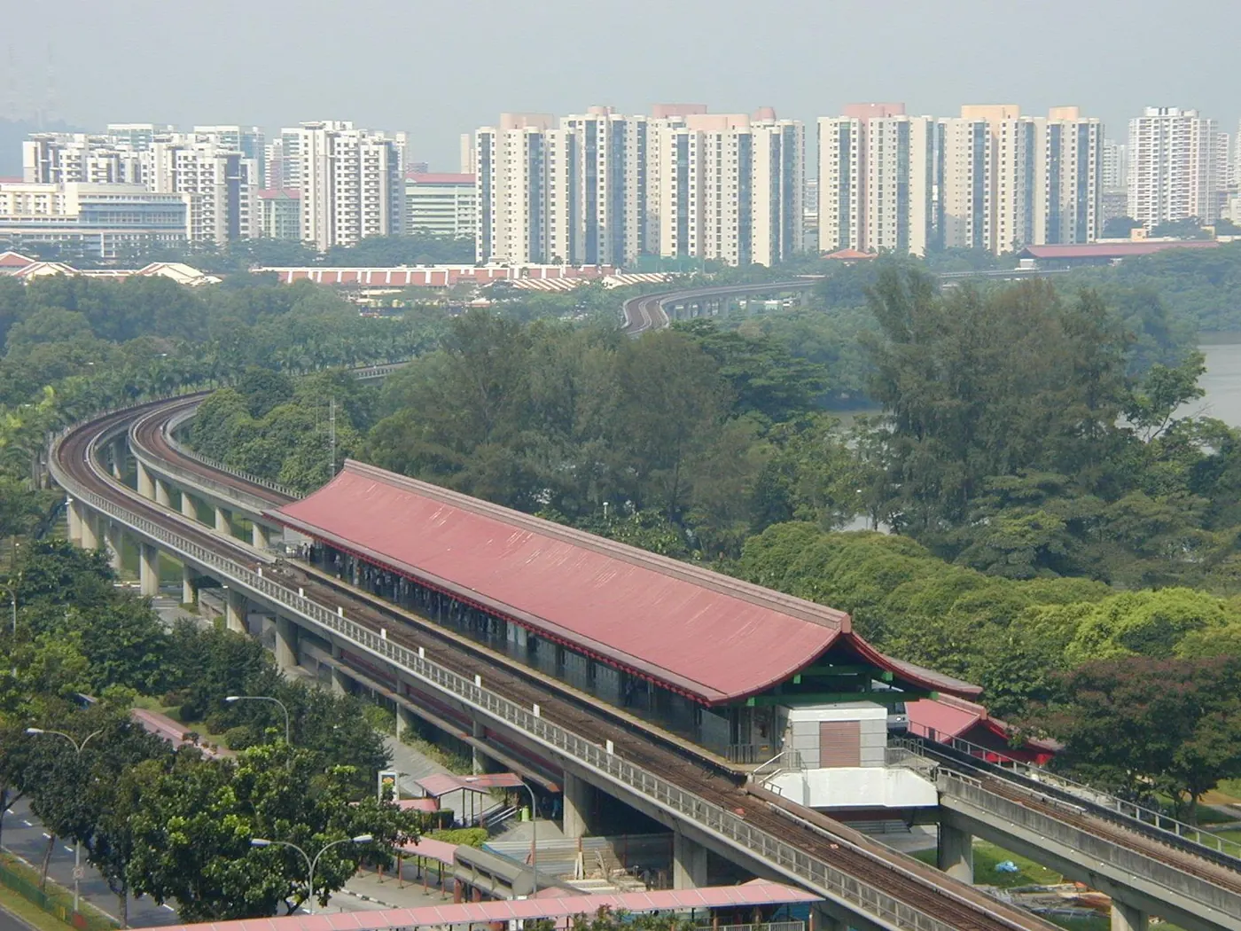 Lakeside MRT station on the elevated East-West Line, with its red roof and HDB blocks behind