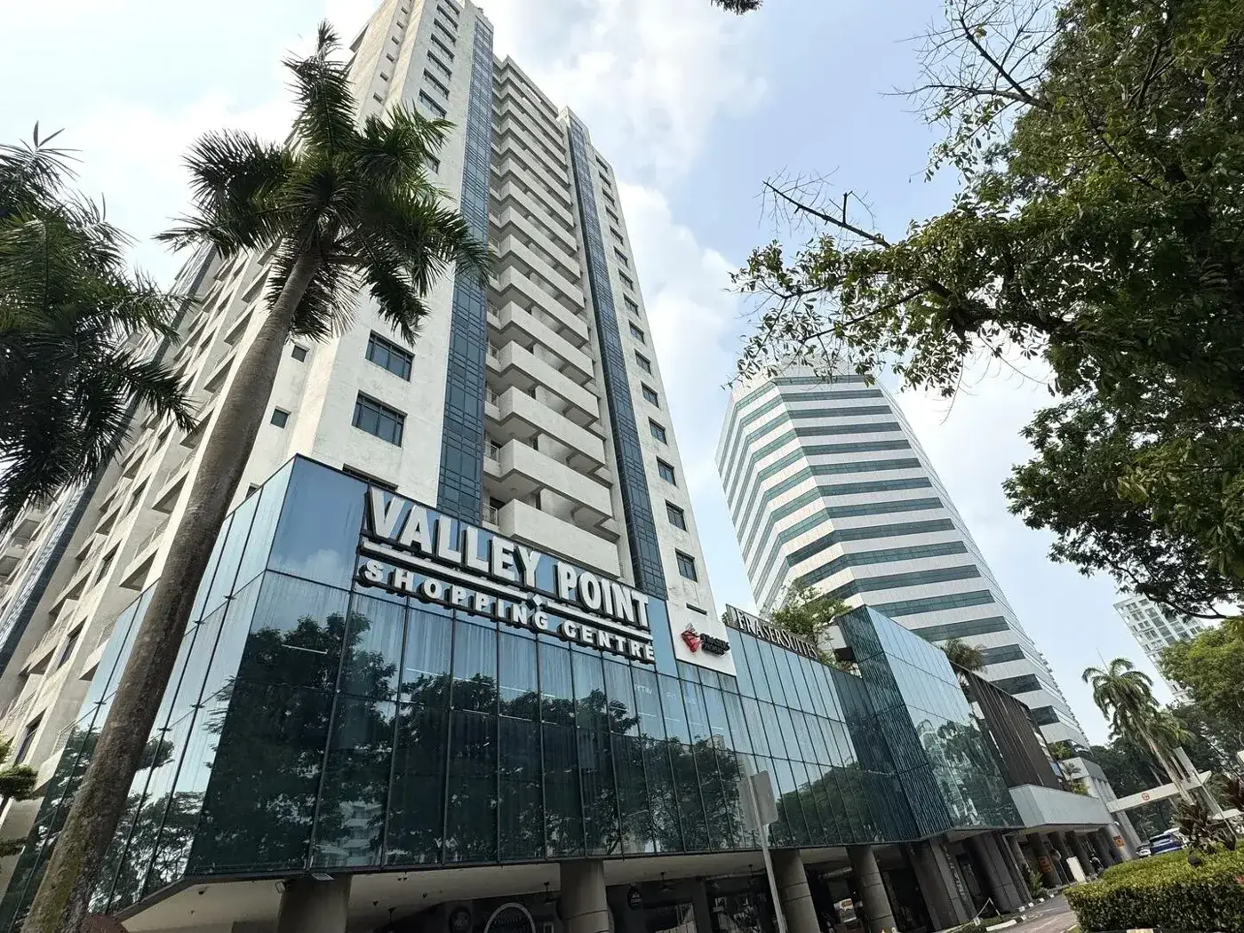 Valley Point Shopping Centre on River Valley Road with its residential tower and glass mall frontage, and the Valley Point office tower beside it